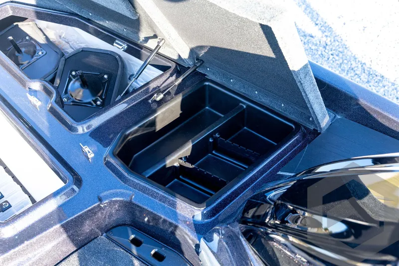 Slide: The Image of Open storage compartment of 2026 Skeeter ZXE21 boat, showcasing interior design and features. - 56