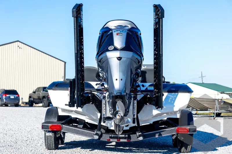 Slide: The Image of 2026 Skeeter ZXE21 boat with powerful outboard motor on trailer, parked outdoors. - 6
