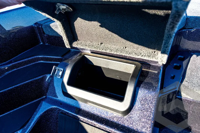 Slide: The Image of Open storage compartment in 2026 Skeeter ZXE21 boat, showcasing interior details. - 60