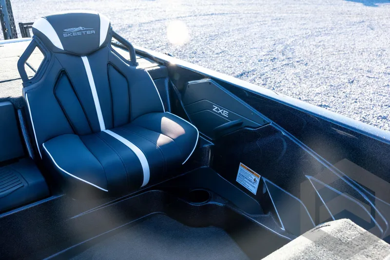 Slide: The Image of 2026 Skeeter ZXE21 boat interior with sleek black and white seating design. - 61