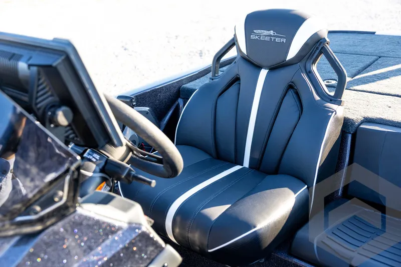Slide: The Image of 2026 Skeeter ZXE21 boat seat with sleek black and white design. - 65