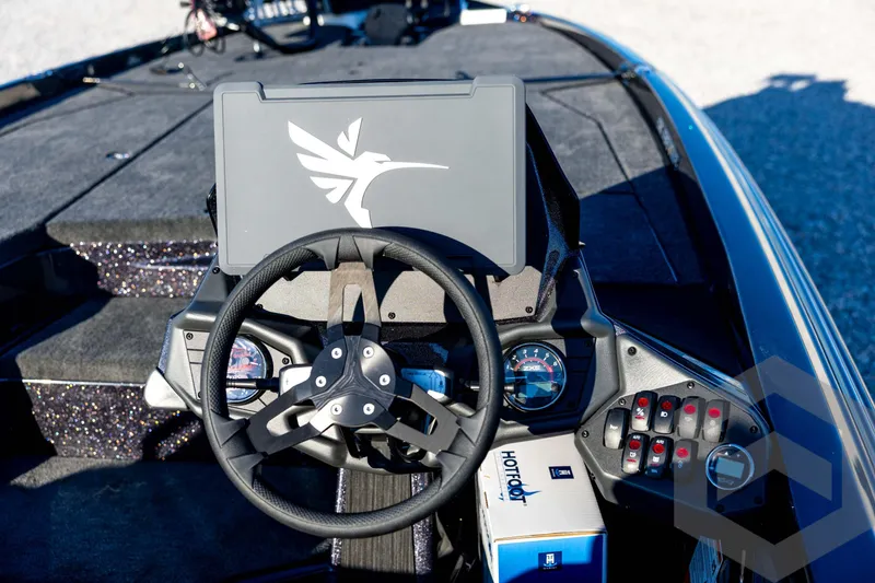 Slide: The Image of Steering console of 2026 Skeeter ZXE21 boat with modern controls and display. - 66