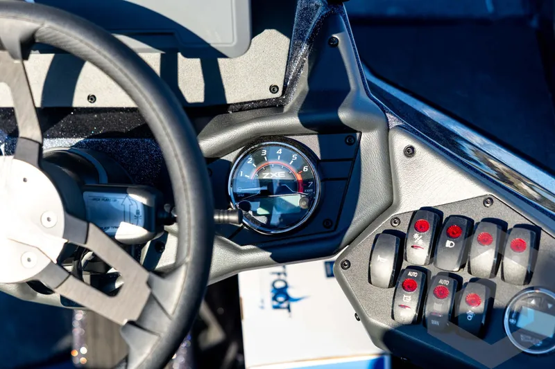 Slide: The Image of Dashboard of 2026 Skeeter ZXE21 boat with steering wheel and control panel. - 68