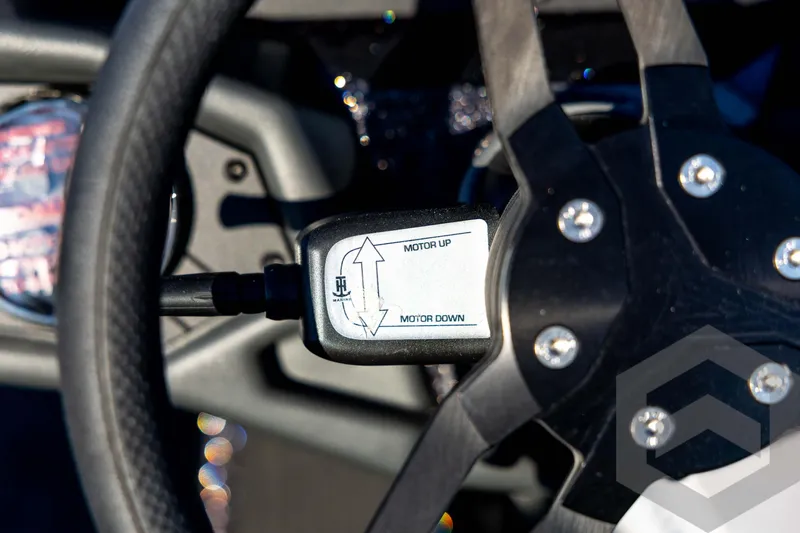 Slide: The Image of Steering wheel of 2026 Skeeter ZXE21 with motor control switch. - 70