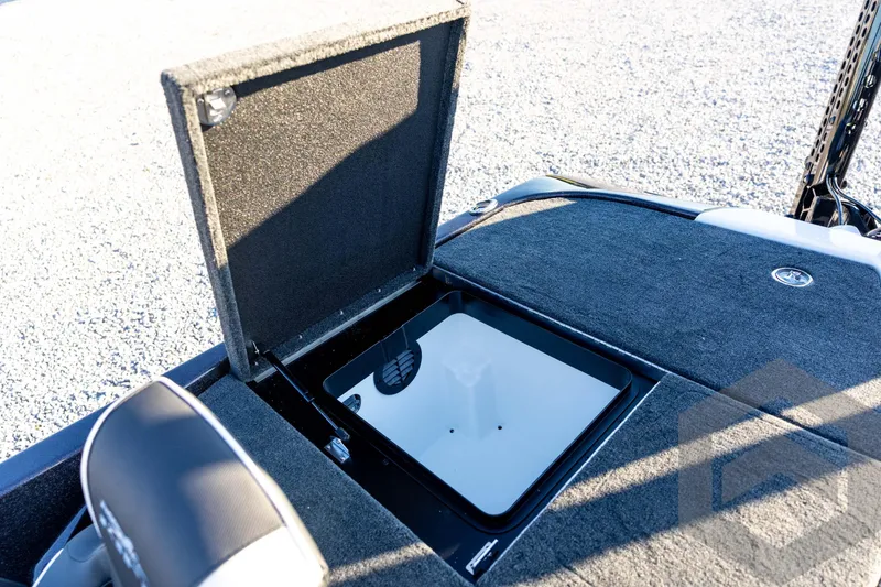 Slide: The Image of Open storage compartment on 2026 Skeeter ZXE21 boat deck, showcasing interior details. - 77