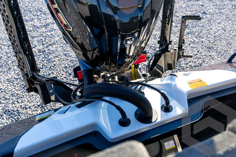 Slide: The Image of 2026 Skeeter ZXE21 boat engine and control panel, detailed view. - 80