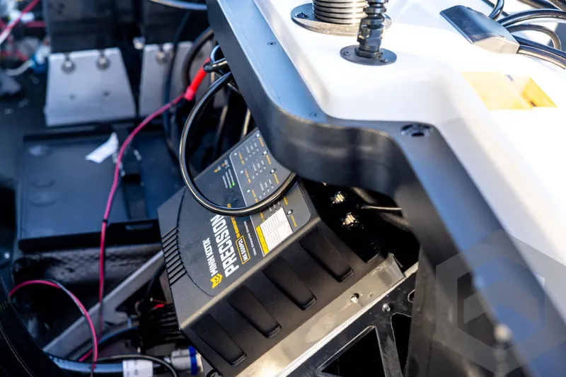 Slide: The Image of Interior of 2026 Skeeter ZXE21 boat featuring Minn Kota Precision charger. - 82