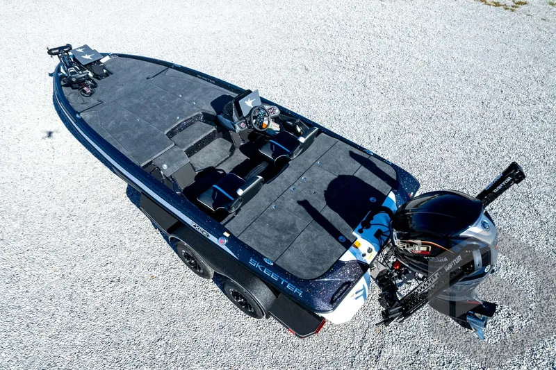 Slide: The Image of 2026 Skeeter ZXE21 fishing boat with dual consoles and Yamaha outboard motor. - 86