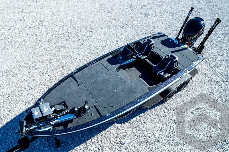 Slide: The Image of 2026 Skeeter ZXE21 fishing boat with dual seats and modern design on gravel surface. - 88