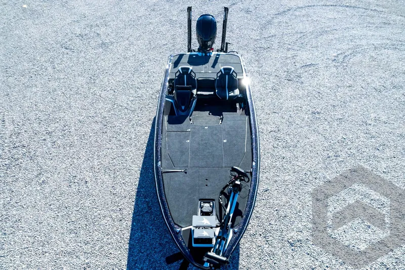 Slide: The Image of 2026 Skeeter ZXE21 fishing boat on gravel surface, top view. - 89