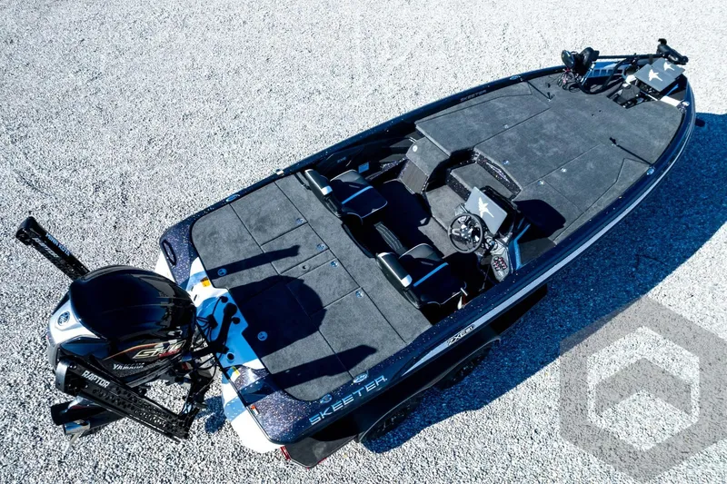 Slide: The Image of 2026 Skeeter ZXE21 fishing boat with Yamaha engine, aerial view on gravel surface. - 92