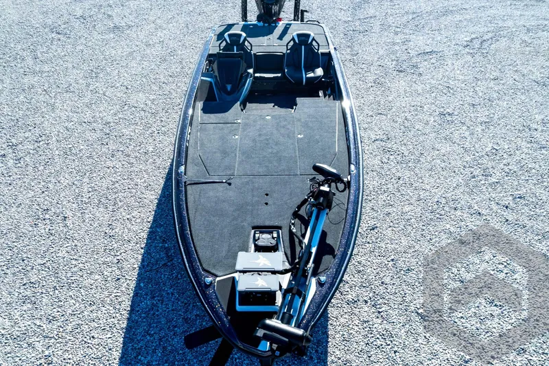 Slide: The Image of 2026 Skeeter ZXE21 fishing boat on gravel, top view. - 94