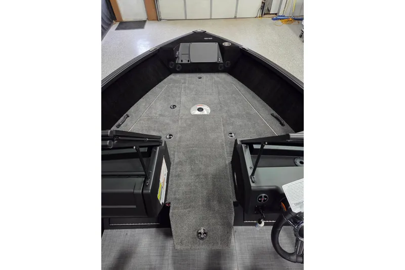 Slide: The Image of 2026 Alumacraft Competitor 185X Sport boat interior with spacious deck and storage compartments. - 5