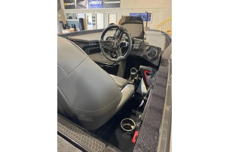 Slide: The Image of 2025 iKon VLX20 boat interior with steering wheel and control panel. - 4
