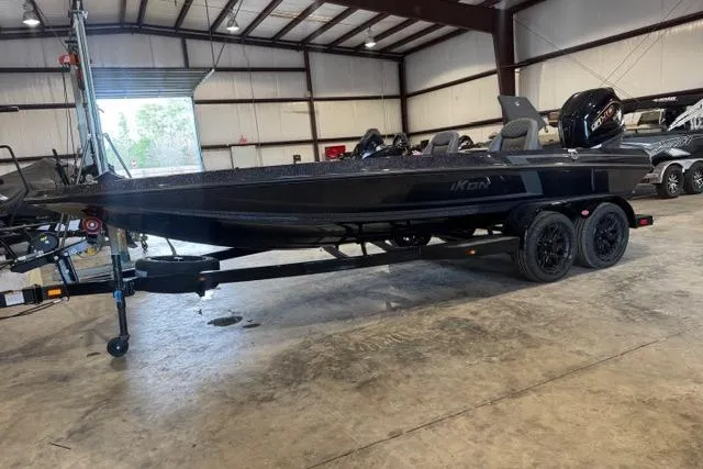 Slide: The Image of 2025 iKon VLX20 boat in warehouse, black finish, on trailer, side view. - 5