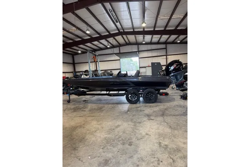 Slide: The Image of 2025 iKon VLX20 boat in a spacious indoor storage facility. - 6