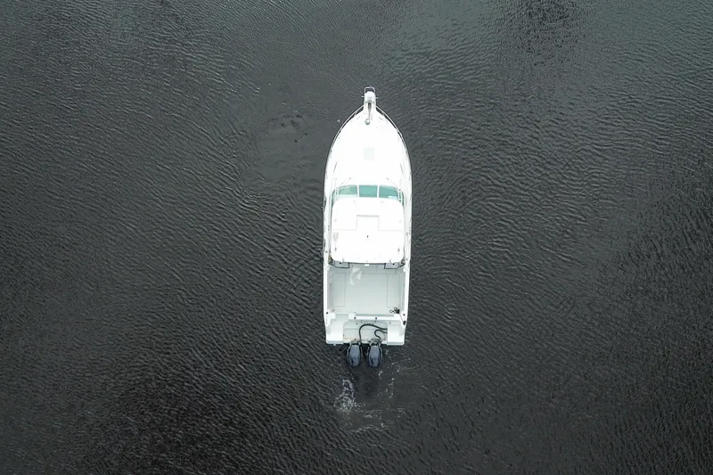 Slide: The Image of Aerial view of 2002 Wellcraft 290 Coastal boat on calm water. - 7