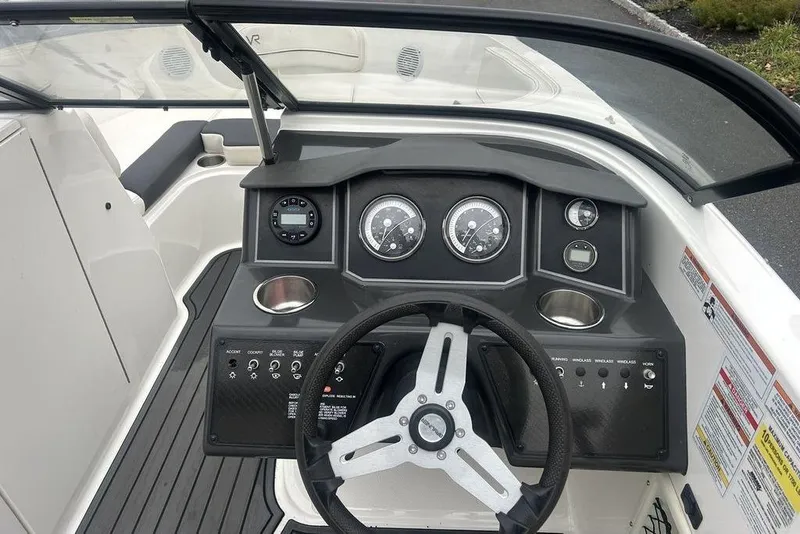 Slide: The Image of 2022 Bayliner VR6 Bowrider OB dashboard with steering wheel and instrument panel. - 5