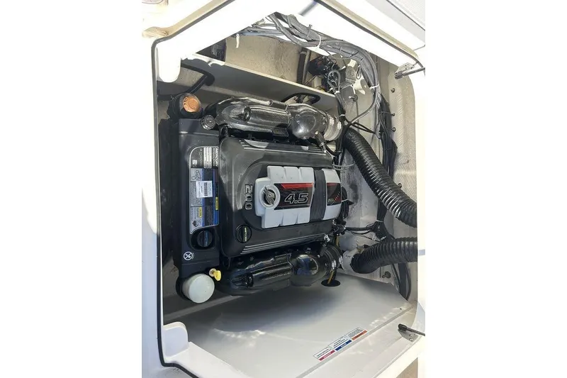 Slide: The Image of 2022 Bayliner VR6 Bowrider OB engine compartment showcasing a 4.5L engine. - 7