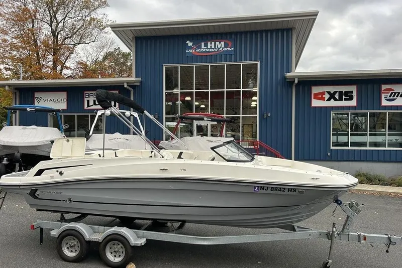 The Image of 2022 Bayliner VR6 Bowrider OB on trailer outside marine dealership. - 0
