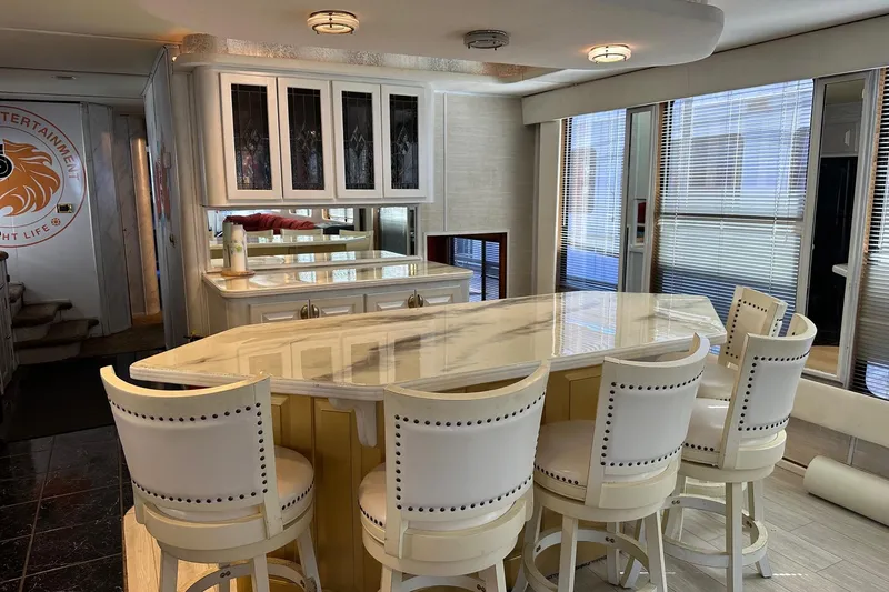 Slide: The Image of Luxurious 1998 Stardust Cruisers 16x86 interior with elegant bar and stylish seating. - 5