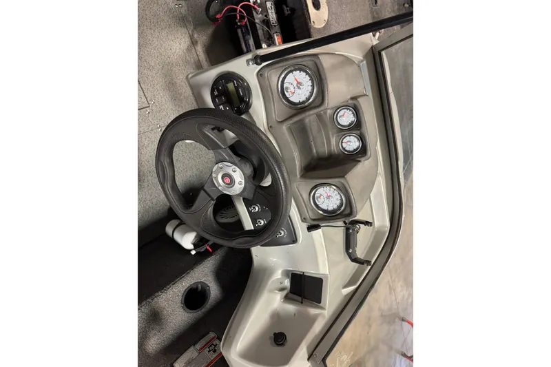 Slide: The Image of 2016 Tracker Pro Guide V-175 Combo dashboard with steering wheel and gauges. - 10