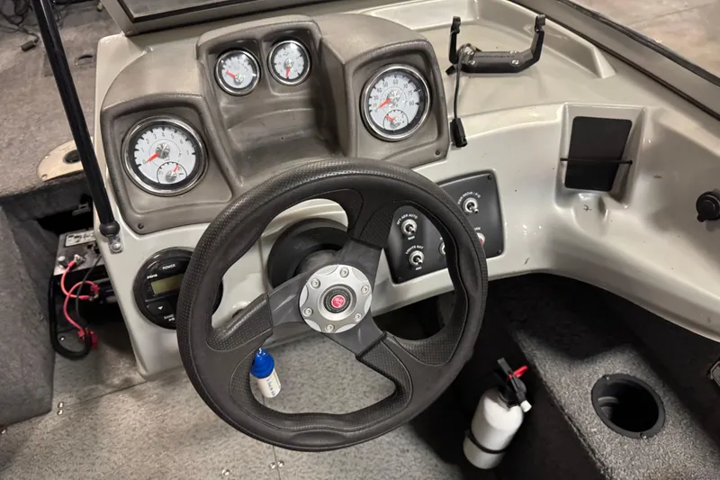 Slide: The Image of 2016 Tracker Pro Guide V-175 Combo dashboard with steering wheel and gauges. - 11