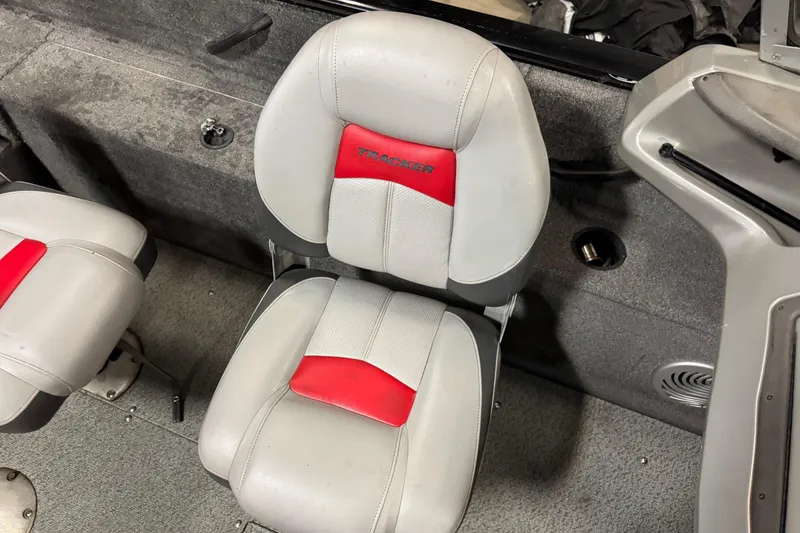 Slide: The Image of 2016 Tracker Pro Guide V-175 Combo boat seat with red and gray upholstery. - 12
