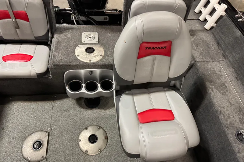 Slide: The Image of 2016 Tracker Pro Guide V-175 Combo boat interior with gray and red seating. - 13