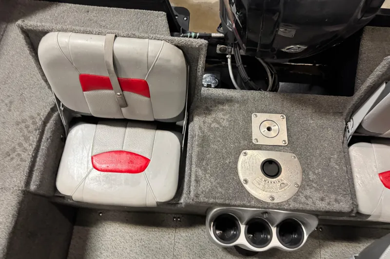 Slide: The Image of 2016 Tracker Pro Guide V-175 Combo boat interior with seating and engine controls. - 14