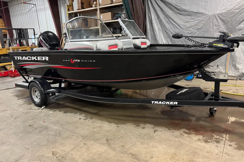 Slide: The Image of 2016 Tracker Pro Guide V-175 Combo boat on trailer in a garage. - 2