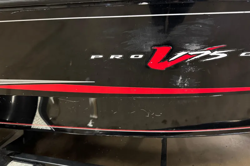 Slide: The Image of 2016 Tracker Pro Guide V-175 Combo boat with black and red detailing. - 7