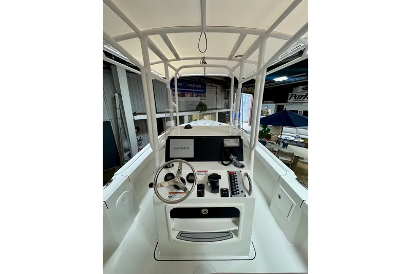 Slide: The Image of 2026 Parker 210 Coastal boat dashboard with Garmin navigation system in a showroom. - 6