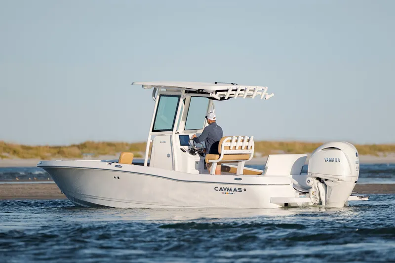 Slide: The Image of 2026 Caymas 24 HB boat cruising on water with Yamaha engine. - 5