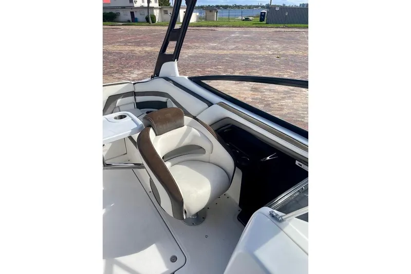 Slide: The Image of 2015 Yamaha Boats 242 Limited S interior with swivel seat and cup holder. - 10