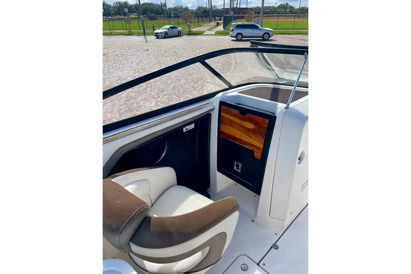 Slide: The Image of 2015 Yamaha Boats 242 Limited S interior with seating and dashboard view. - 11