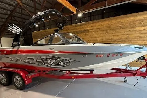 The Image of 2007 Malibu Wakesetter 20 VTX boat on red trailer in indoor storage. - 1