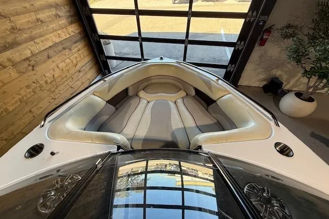 Slide: The Image of 2007 Malibu Wakesetter 20 VTX boat interior with plush seating in a showroom. - 10