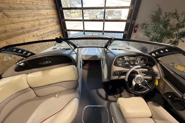 Slide: The Image of 2007 Malibu Wakesetter 20 VTX boat interior with steering wheel and seating. - 11