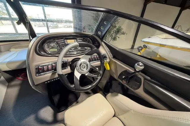 Slide: The Image of 2007 Malibu Wakesetter 20 VTX boat interior with steering wheel and control panel. - 12