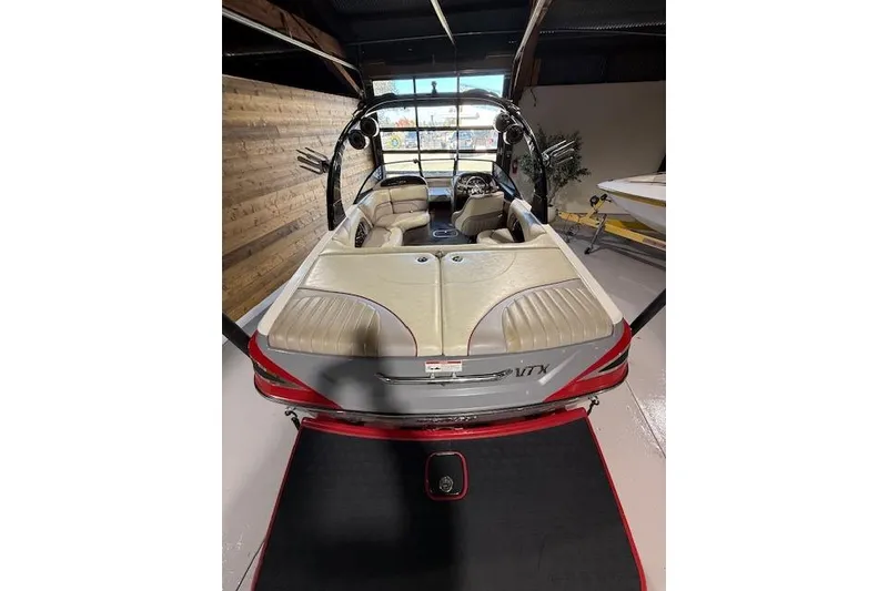 Slide: The Image of 2007 Malibu Wakesetter 20 VTX boat interior with beige seating and sleek design. - 15
