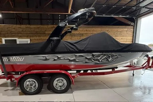 Slide: The Image of 2007 Malibu Wakesetter 20 VTX boat on red trailer, covered and stored indoors. - 20