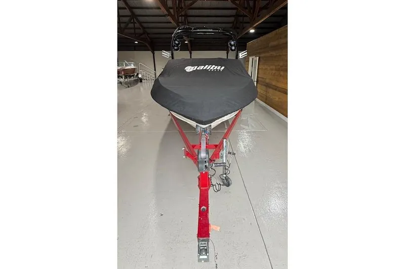 Slide: The Image of 2007 Malibu Wakesetter 20 VTX boat with cover on red trailer in storage. - 23