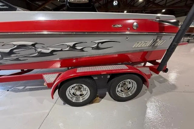 Slide: The Image of 2007 Malibu Wakesetter 20 VTX boat on a red trailer in a showroom. - 6