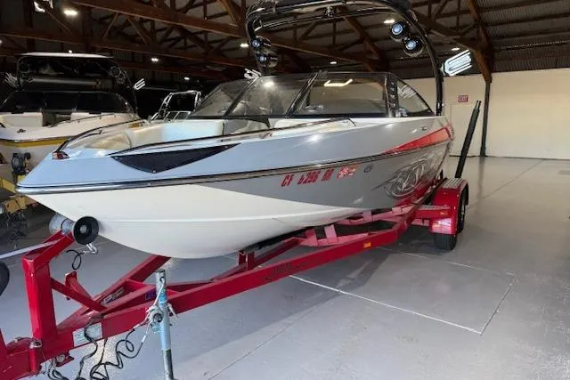 Slide: The Image of 2007 Malibu Wakesetter 20 VTX boat on red trailer in indoor storage. - 8