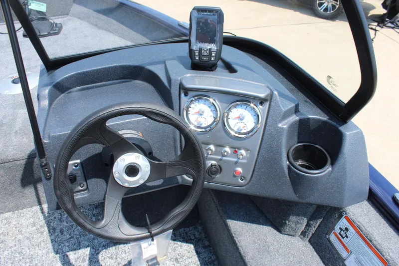 Slide: The Image of 2026 Tracker Pro Guide V-16 WT dashboard with steering wheel and gauges. - 12