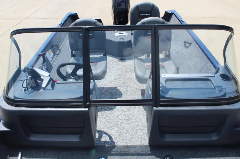 Slide: The Image of 2026 Tracker Pro Guide V-16 WT boat interior with dual seats and steering console. - 19