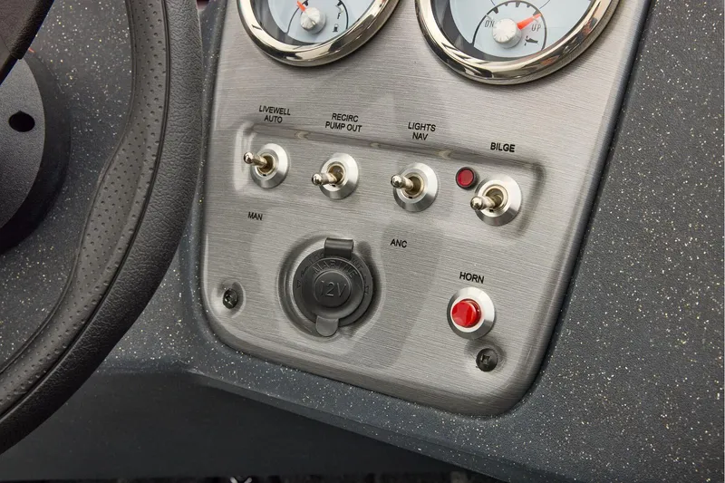 Slide: The Image of Manufacturer Provided Image: Control panel of 2026 Tracker Pro Guide V-16 WT boat with switches and gauges. - 49