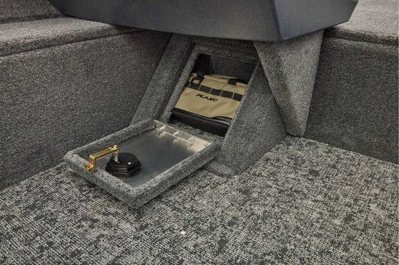 Slide: The Image of Manufacturer Provided Image: 2026 Tracker Pro Guide V-16 WT boat storage compartment with carpeted interior and tackle box. - 54