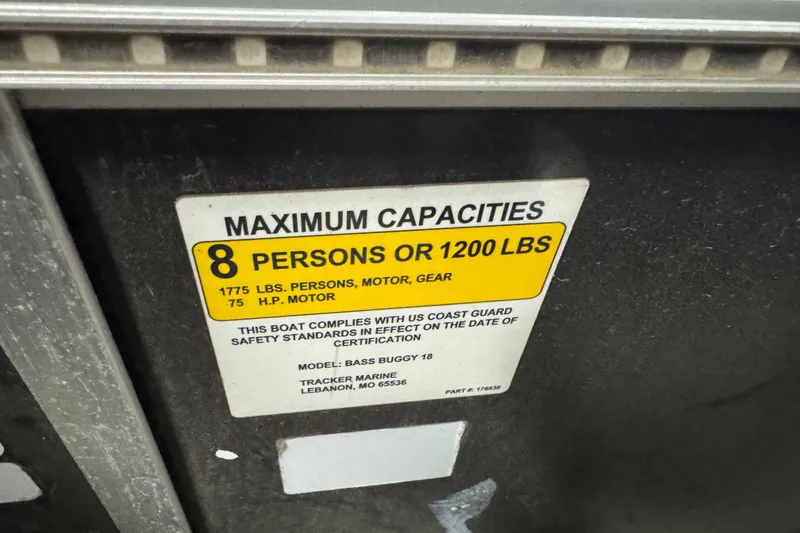 Slide: The Image of 2018 Sun Tracker Bass Buggy 18 DLX capacity label, 8 persons or 1200 lbs limit. - 13